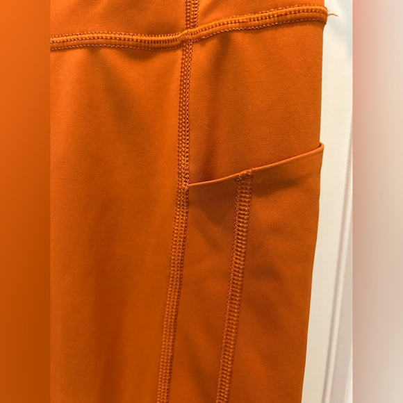 Athleta salutation stash pocket leggings in foliage orange - Picture 6 of 8